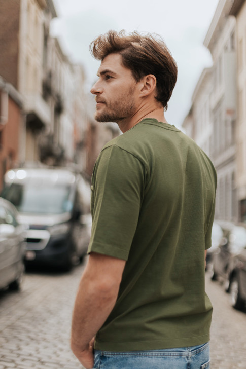 khaki top and blue jeans